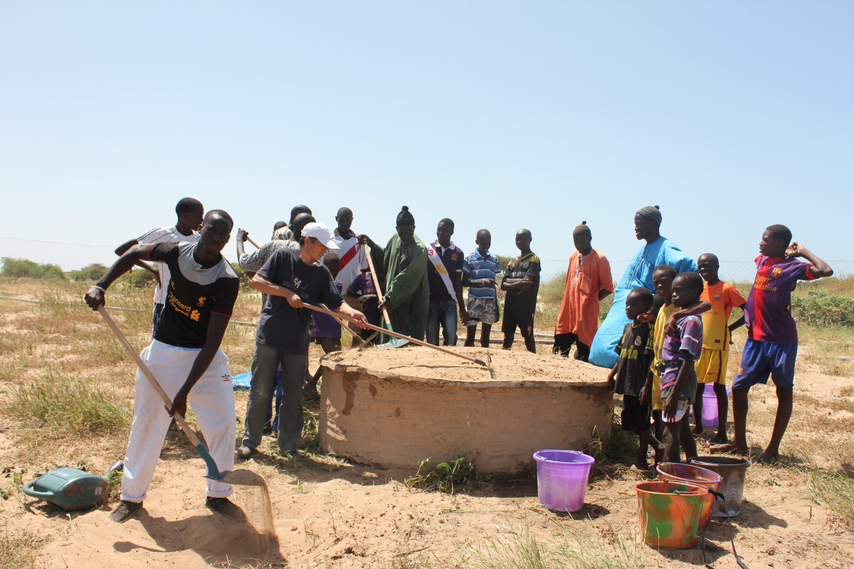 Chinese technician showing composting technique in Senegal project 2013