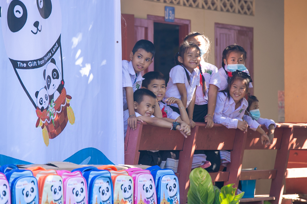  Beneficiary students in Laos happily waiting to receive the Panda Packs, 2020 (photo by Xinhua)